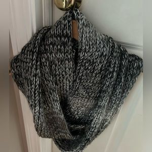 Women’s Infiniti loop scarf. Gray and black knit material.